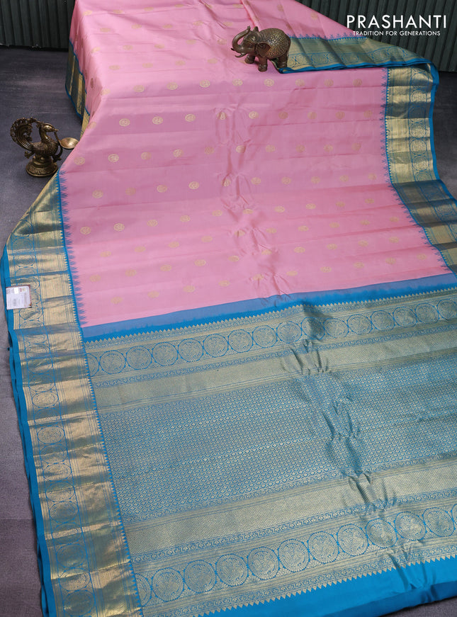 Pure gadwal silk saree peach pink shade and teal blue with zari woven buttas and rich zari woven korvai border