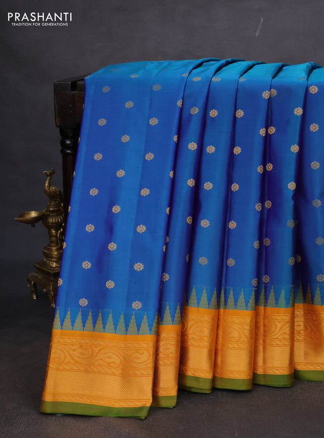 Pure gadwal silk saree dual shade of blue and mustard yellow with zari woven buttas and rich zari woven korvai border