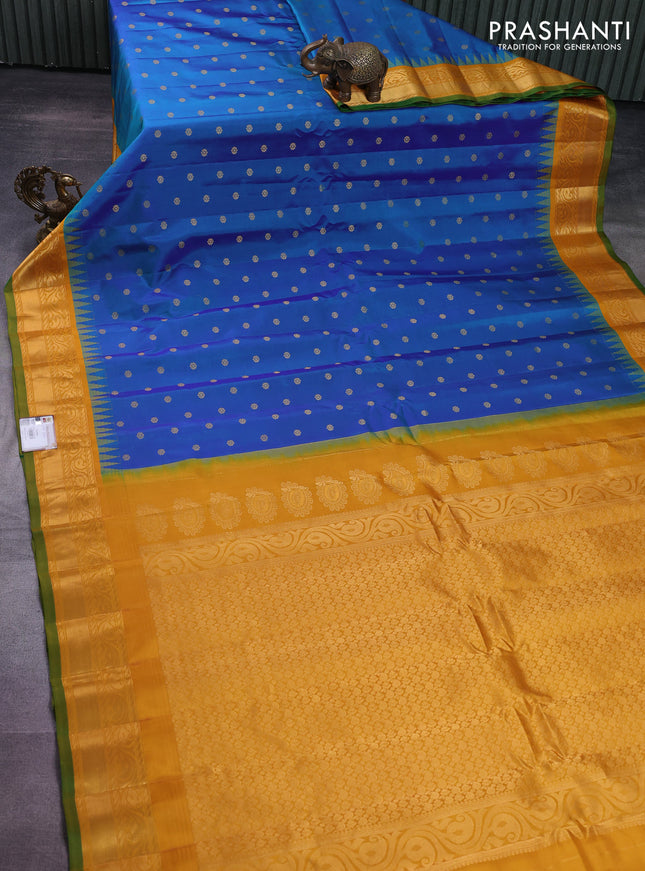 Pure gadwal silk saree dual shade of blue and mustard yellow with zari woven buttas and rich zari woven korvai border