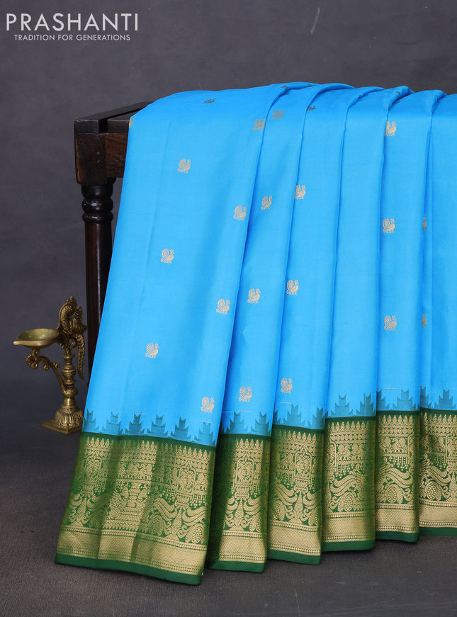 Pure gadwal silk saree light blue and green with annam zari woven buttas and rich zari woven korvai border