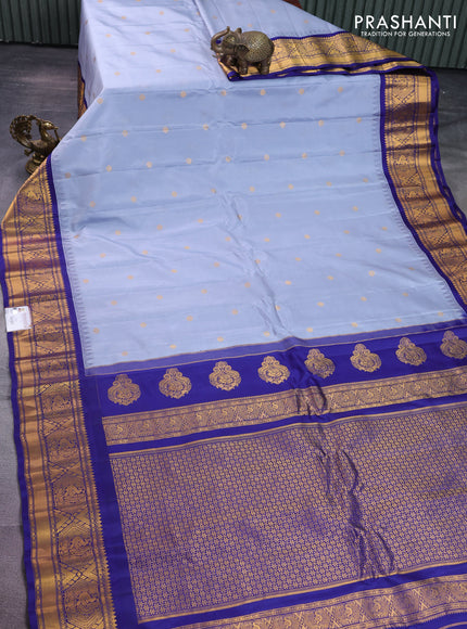 Pure gadwal silk saree grey and blue with zari woven buttas and temple design zari woven korvai border