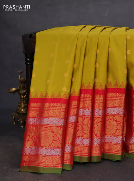 Pure gadwal silk saree mustard yellow and red with floral zari woven buttas and long temple design zari woven korvai border