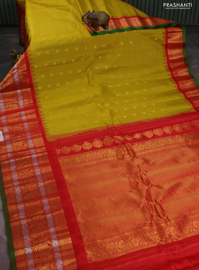 Pure gadwal silk saree mustard yellow and red with floral zari woven buttas and long temple design zari woven korvai border