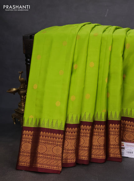 Pure gadwal silk saree light green and deep maroon with zari woven buttas and temple design zari woven korvai border