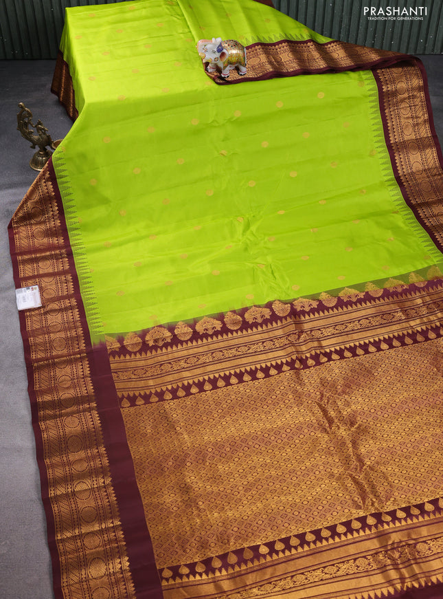 Pure gadwal silk saree light green and deep maroon with zari woven buttas and temple design zari woven korvai border