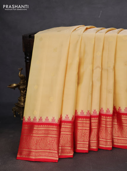 Pure gadwal silk saree pale yellow and red with paisley zari woven buttas and temple design zari woven border