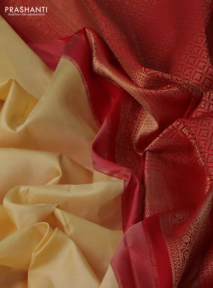 Pure gadwal silk saree pale yellow and red with paisley zari woven buttas and temple design zari woven border