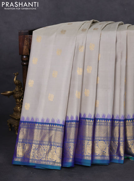 Pure gadwal silk saree pastel grey and dual shade of bluish green with annam zari woven buttas and temple design zari woven border
