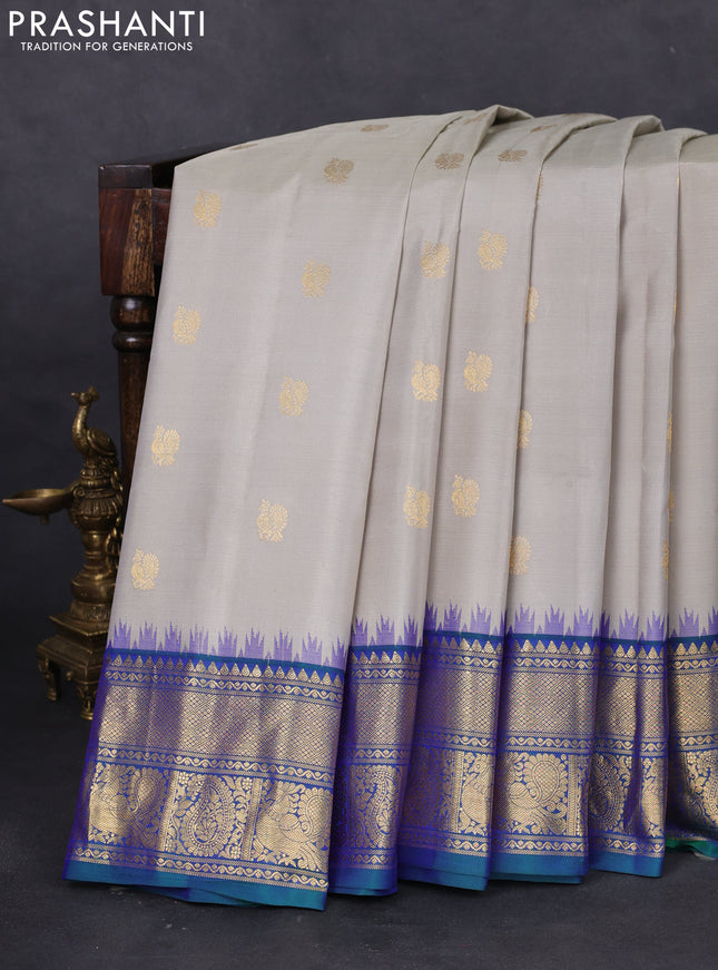 Pure gadwal silk saree pastel grey and dual shade of bluish green with annam zari woven buttas and temple design zari woven border
