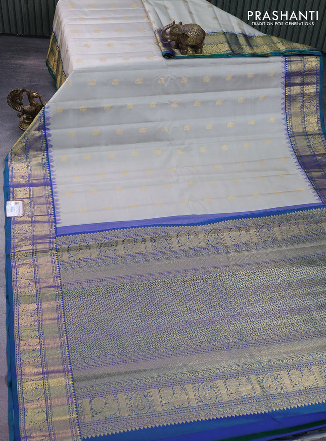 Pure gadwal silk saree pastel grey and dual shade of bluish green with annam zari woven buttas and temple design zari woven border