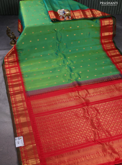 Pure gadwal silk saree dual shade of green and red with floral zari woven buttas and temple design zari woven border