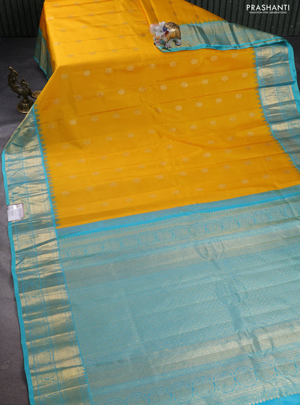 Pure gadwal silk saree yellow and teal blue with zari woven buttas and temple design zari woven border