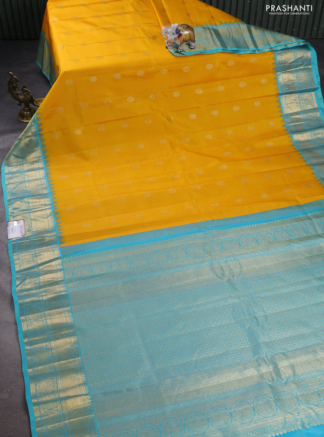 Pure gadwal silk saree yellow and teal blue with zari woven buttas and temple design zari woven border