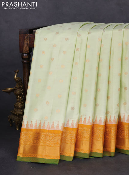 Pure gadwal silk saree off white and mustard yellow with floral zari woven buttas and temple design zari woven border