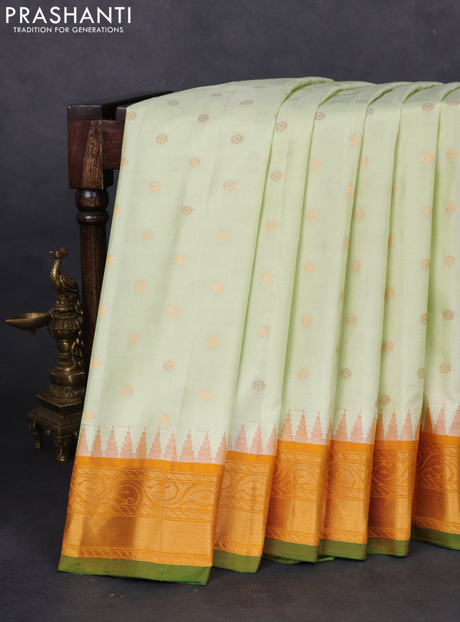 Pure gadwal silk saree off white and mustard yellow with floral zari woven buttas and temple design zari woven border