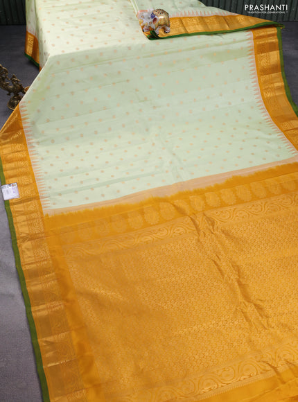 Pure gadwal silk saree off white and mustard yellow with floral zari woven buttas and temple design zari woven border