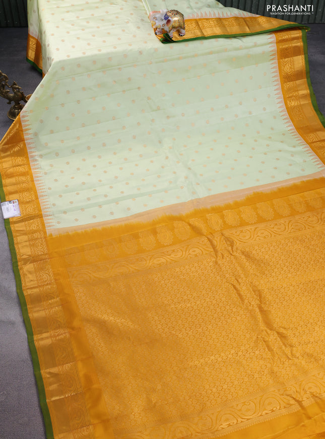 Pure gadwal silk saree off white and mustard yellow with floral zari woven buttas and temple design zari woven border