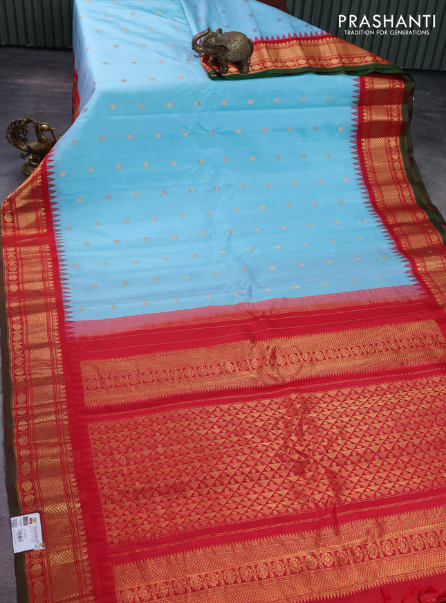 Pure gadwal silk saree light blue and red with floral zari woven buttas and temple design zari woven border