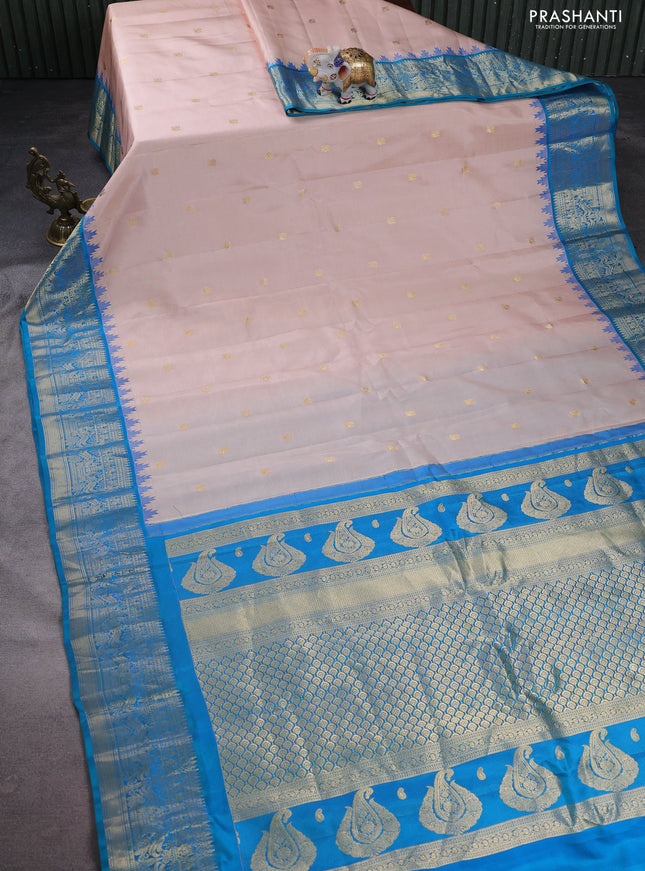 Pure gadwal silk saree pastel peach and dual shade of teal blue with annam zari woven buttas and temple design zari woven border
