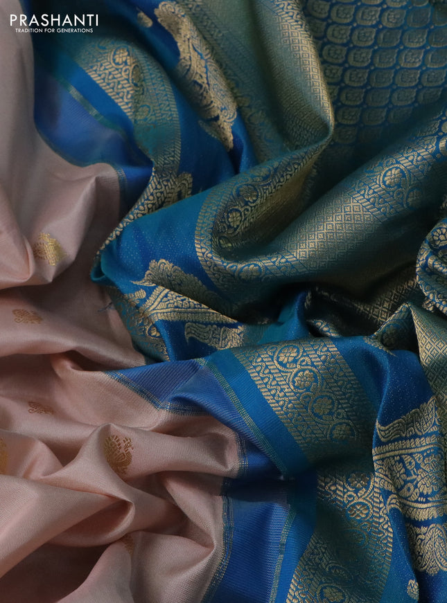 Pure gadwal silk saree pastel peach and dual shade of teal blue with annam zari woven buttas and temple design zari woven border