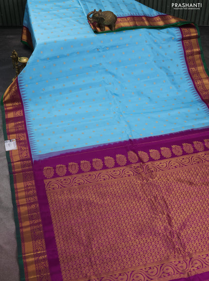Pure gadwal silk saree light blue and purple with allover zari woven buttas and temple design zari woven border