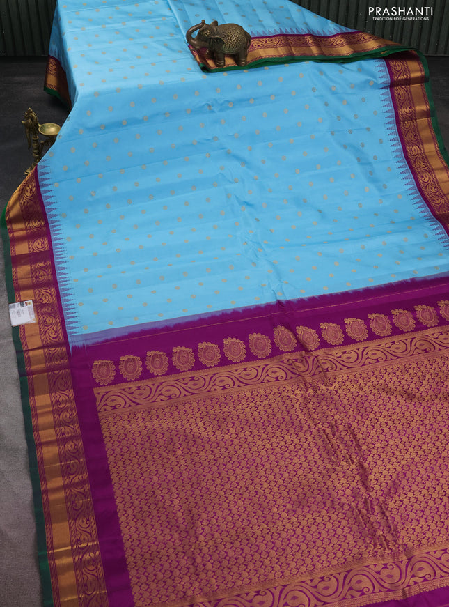Pure gadwal silk saree light blue and purple with allover zari woven buttas and temple design zari woven border