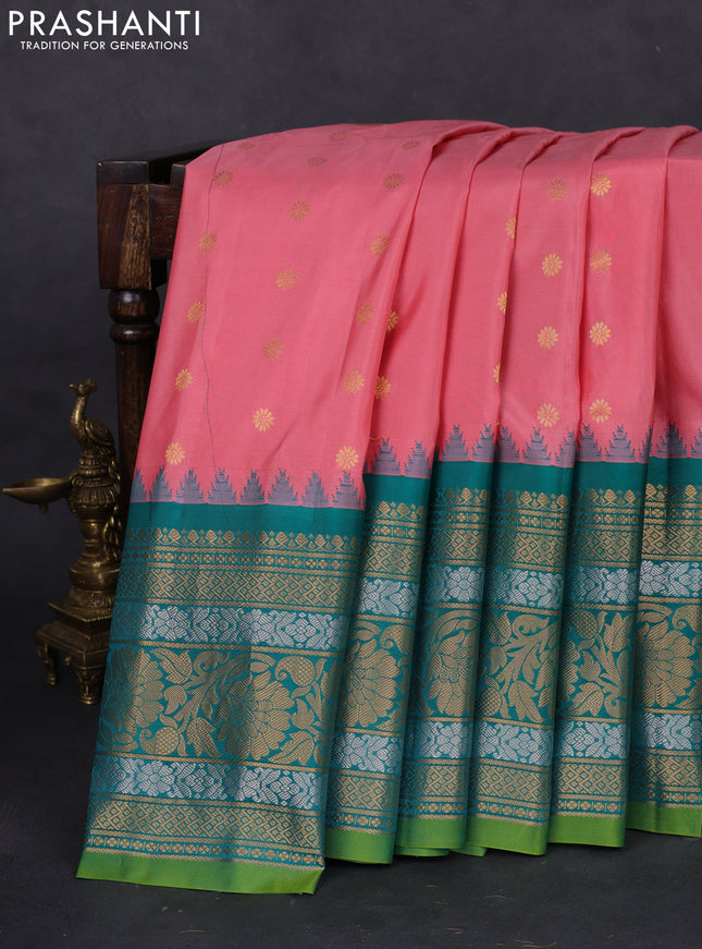 Pure gadwal silk saree pastel peach pink and teal green with floral zari woven buttas and long temple design zari woven border