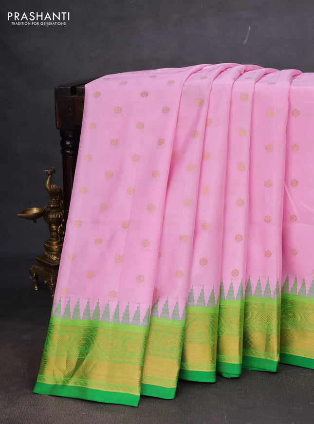 Pure gadwal silk saree light pink and green with floral zari woven buttas and temple design zari woven border