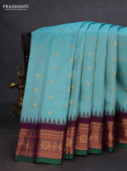 Pure gadwal silk saree teal blue and wine shade with floral zari woven buttas and temple design zari woven border