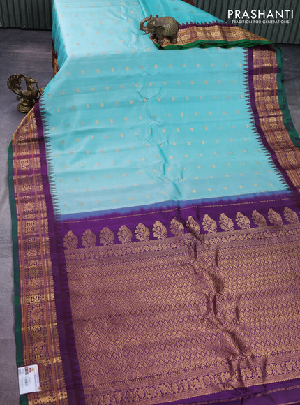 Pure gadwal silk saree teal blue and wine shade with floral zari woven buttas and temple design zari woven border