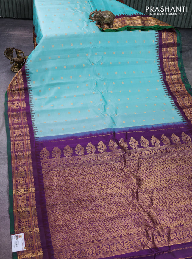 Pure gadwal silk saree teal blue and wine shade with floral zari woven buttas and temple design zari woven border