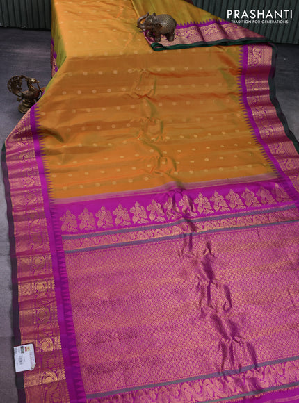 Pure gadwal silk saree dual shade of mustard and purple with floral zari woven buttas and temple design zari woven border