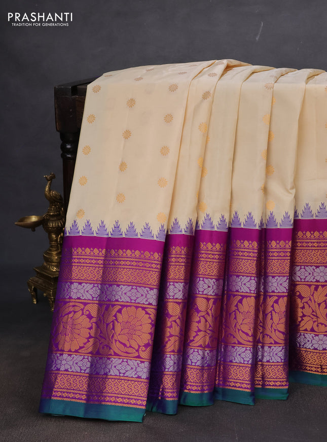Pure gadwal silk saree cream and purple with floral zari woven buttas and long temple design zari woven floral border