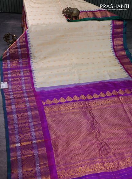 Pure gadwal silk saree cream and purple with floral zari woven buttas and long temple design zari woven floral border