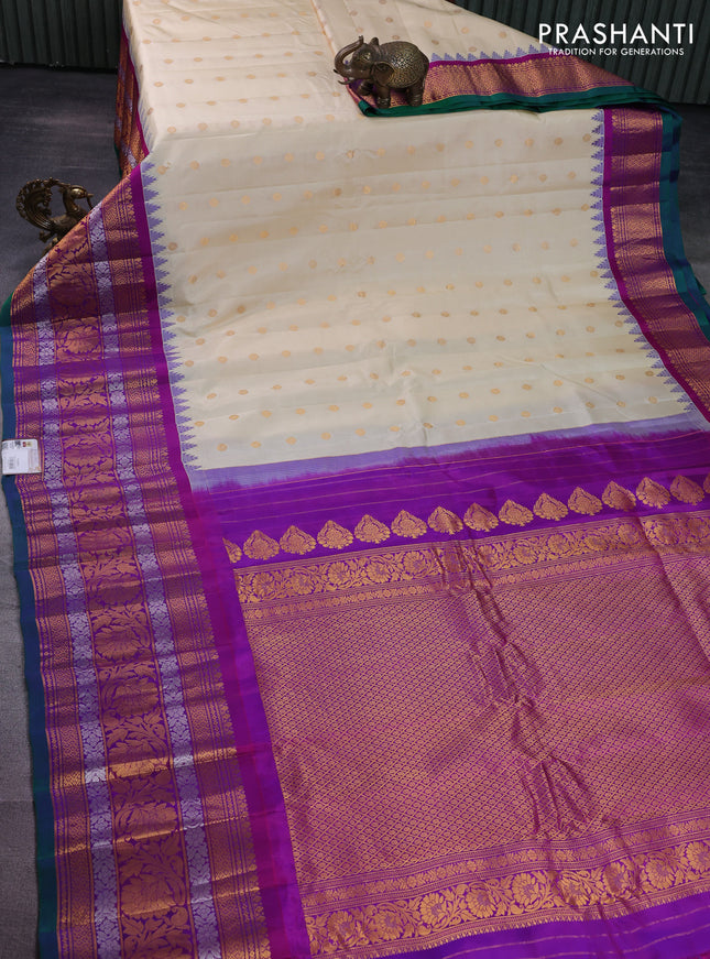 Pure gadwal silk saree cream and purple with floral zari woven buttas and long temple design zari woven floral border