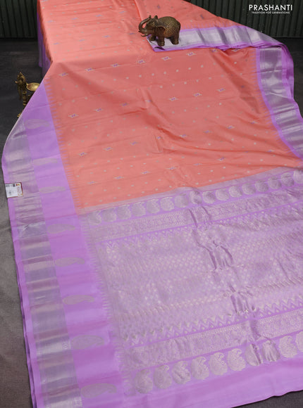 Pure gadwal silk saree peach shade and lavender with silver zari woven buttas and long temple design paisley silver zari woven border
