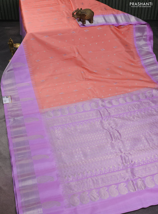 Pure gadwal silk saree peach shade and lavender with silver zari woven buttas and long temple design paisley silver zari woven border
