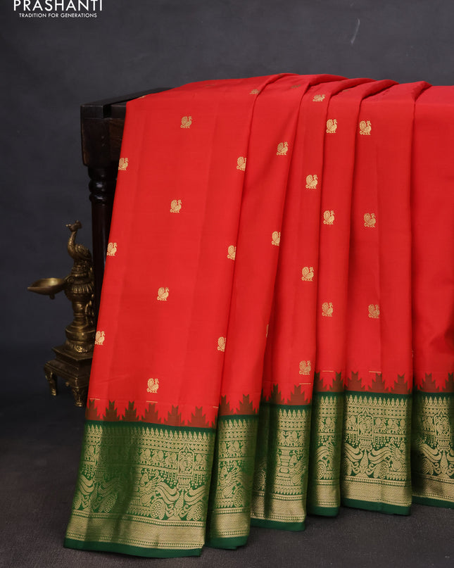 Pure gadwal silk saree orange and dark green with annam zari woven buttas and temple design zari woven border