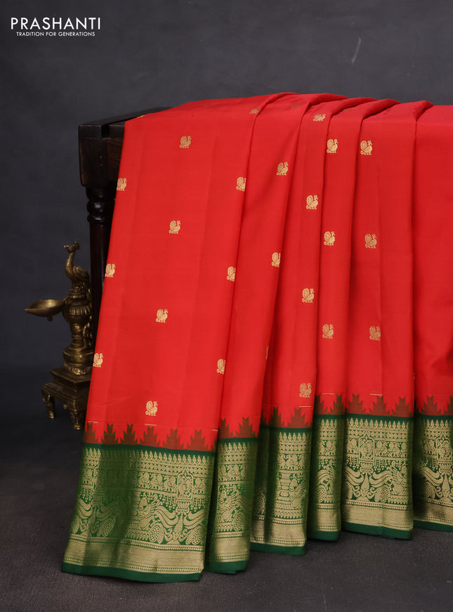 Pure gadwal silk saree orange and dark green with annam zari woven buttas and temple design zari woven border