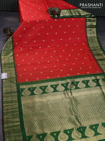 Pure gadwal silk saree orange and dark green with annam zari woven buttas and temple design zari woven border