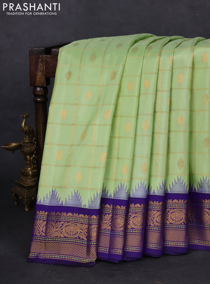 Pure gadwal silk saree pista green and blue with allover zari checks & buttas and temple design zari woven korvai border