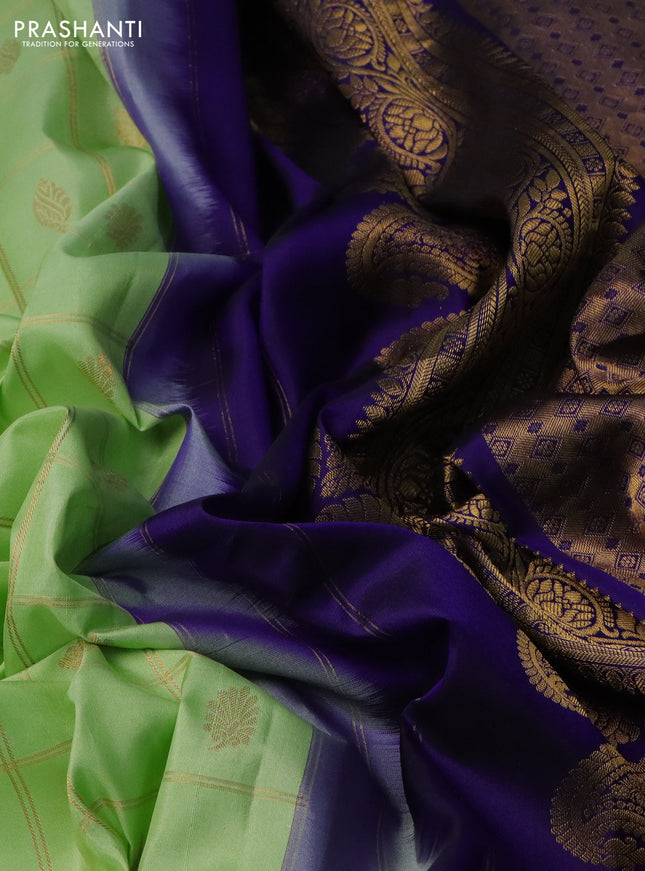 Pure gadwal silk saree pista green and blue with allover zari checks & buttas and temple design zari woven korvai border