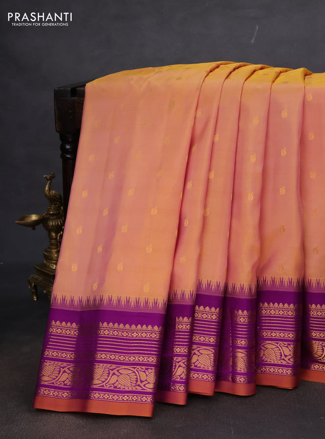 Pure gadwal silk saree dual shade of yellowish peach and purple with zari woven buttas and temple design zari woven border