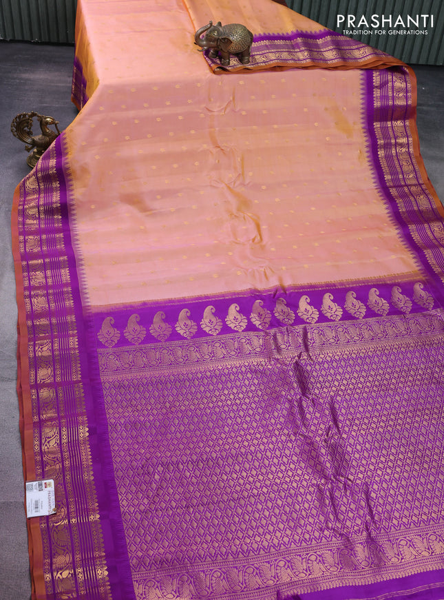Pure gadwal silk saree dual shade of yellowish peach and purple with zari woven buttas and temple design zari woven border