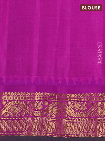 Pure gadwal silk saree green and purple with allover zari woven buttas and temple design zari woven border