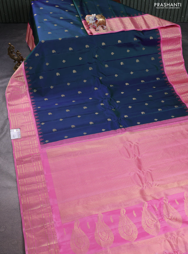 Pure gadwal silk saree dual shade of bluish green and light pink with paisley zari woven buttas and temple design zari woven border