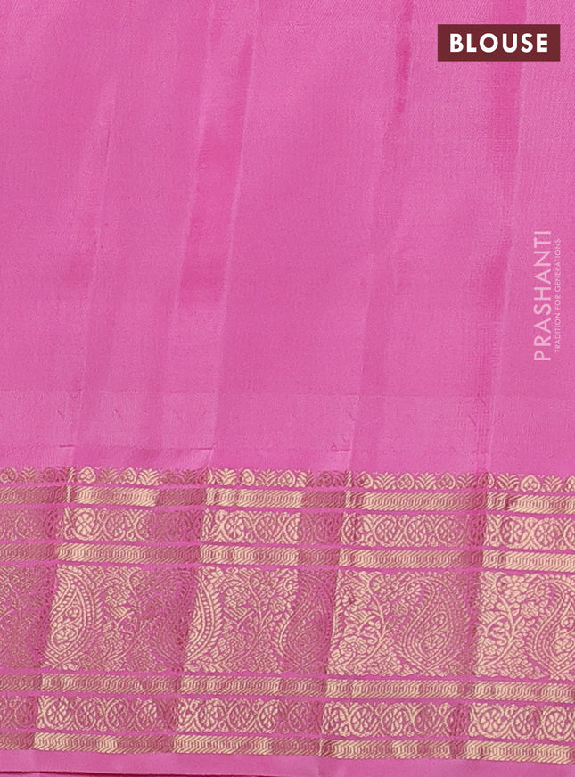 Pure gadwal silk saree dual shade of bluish green and light pink with paisley zari woven buttas and temple design zari woven border