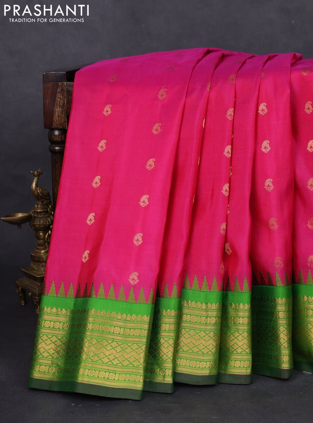 Pure gadwal silk saree pink and green with paisley zari woven buttas and temple design zari woven border