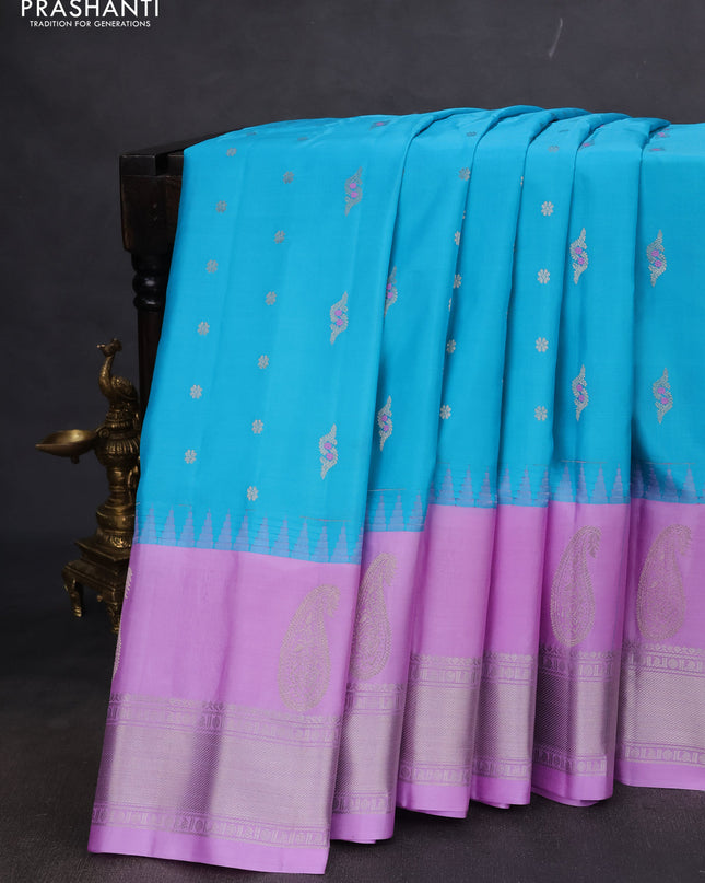 Pure gadwal silk saree light blue and lavender with allover silver zari woven buttas and long temple design silver zari woven border