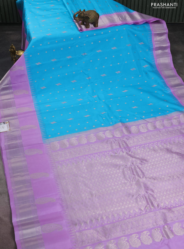 Pure gadwal silk saree light blue and lavender with allover silver zari woven buttas and long temple design silver zari woven border